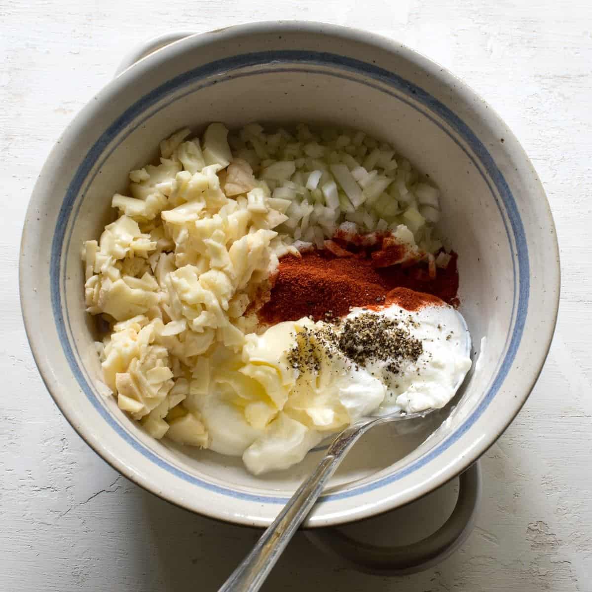 Ingredients to make Czech Romadur bread spread in bowl before mixing them up.