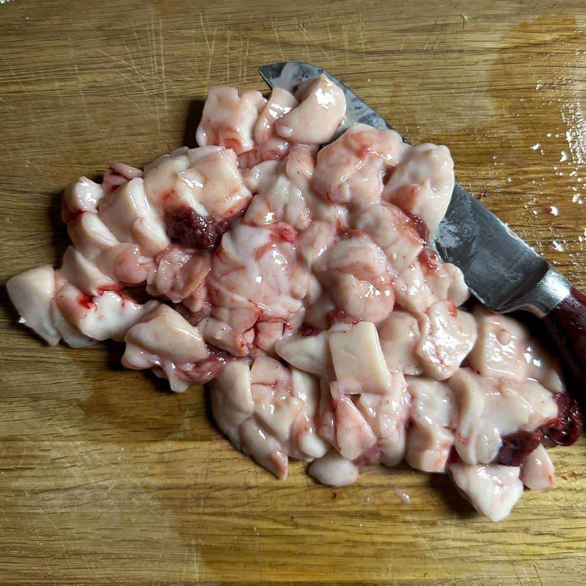 cut carp milt on a kitchen board.