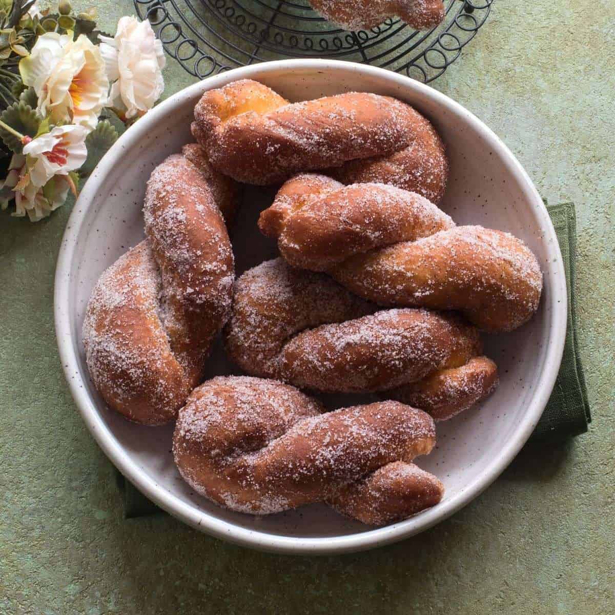 Fried šišky served in a round bowl.