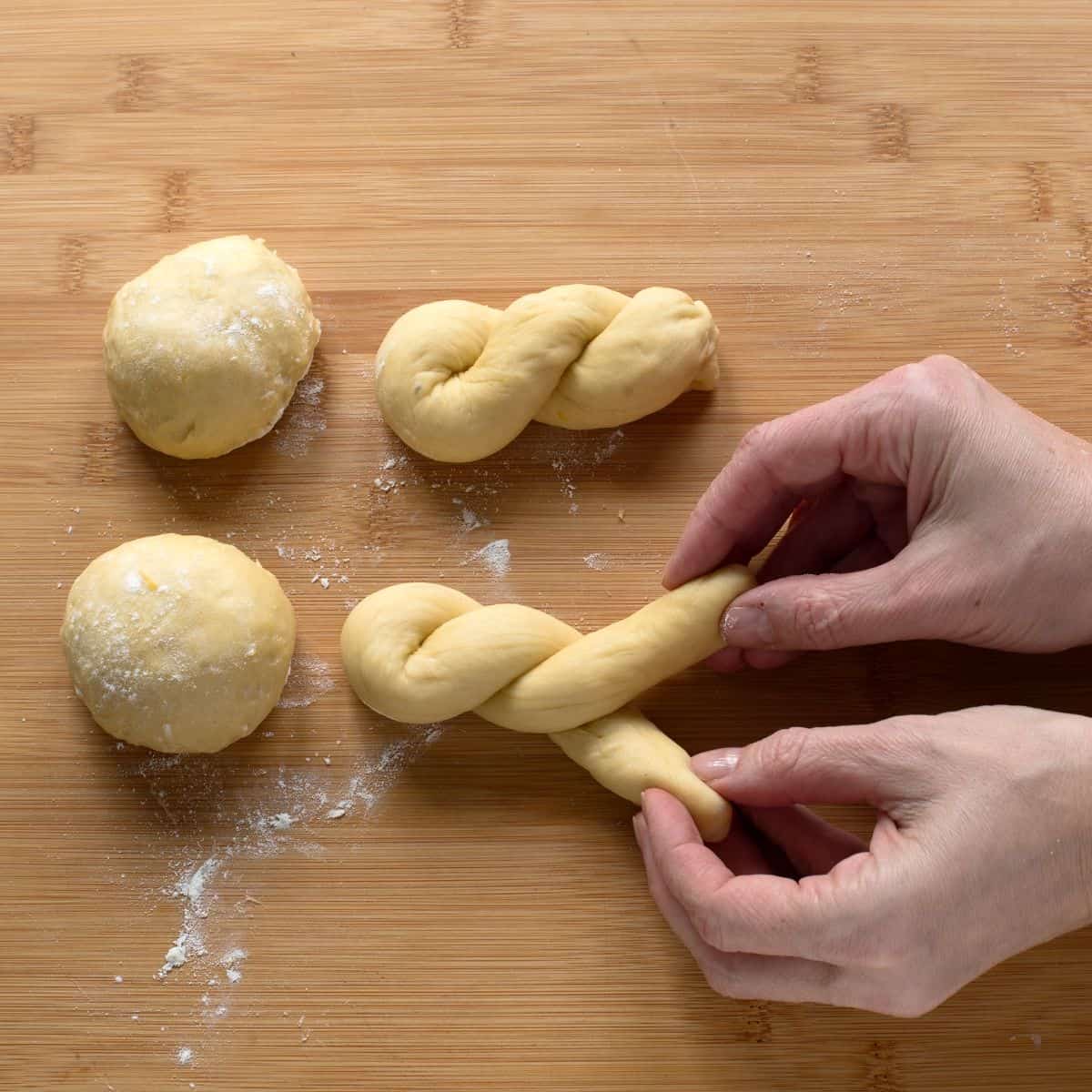 Shaping Czech šišky into a twisted shape.