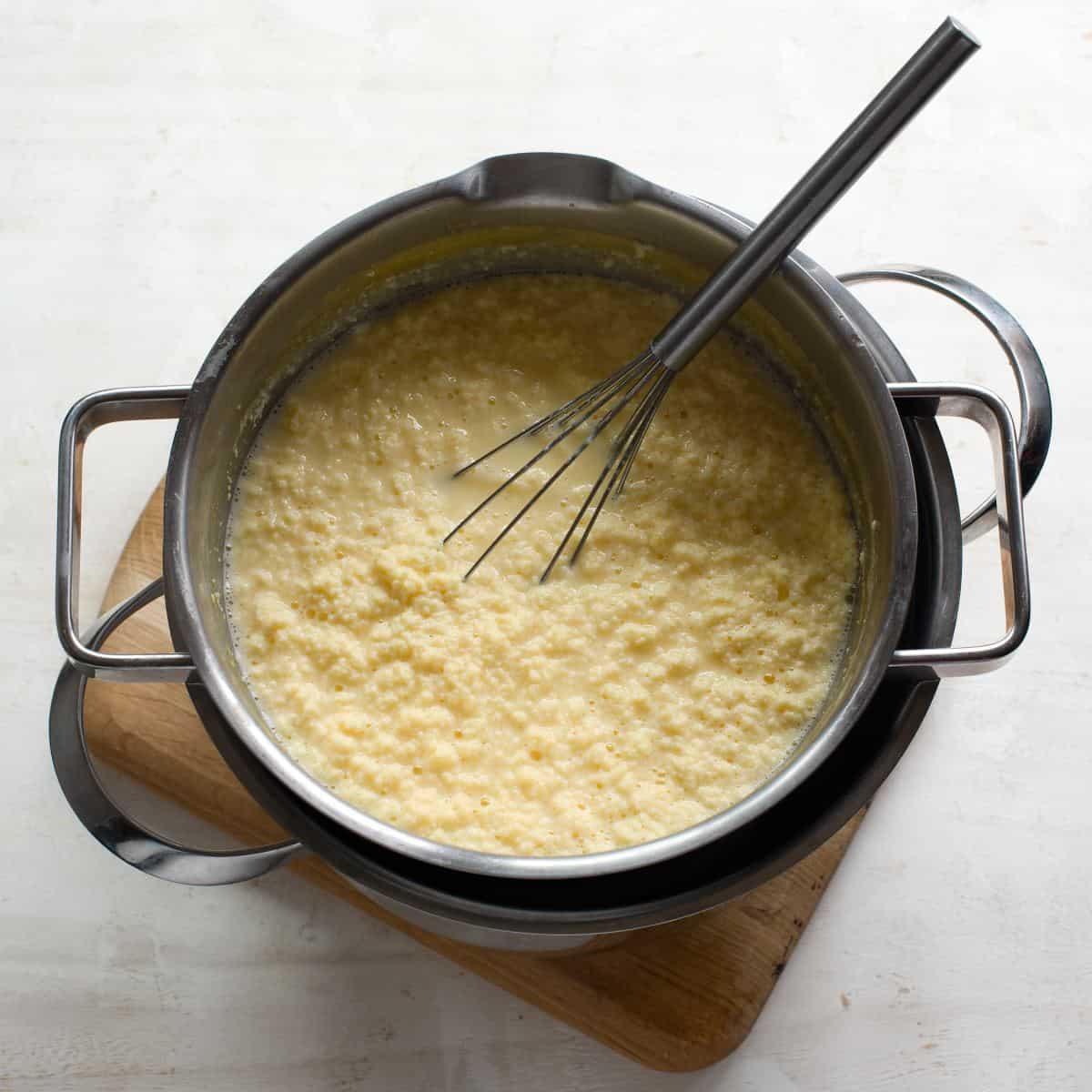 Curdled egg cheese in a pot.