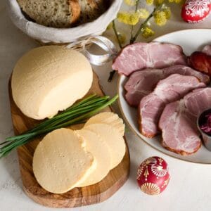 Slovak Easter egg cheese - syrek served with chive and sausages.