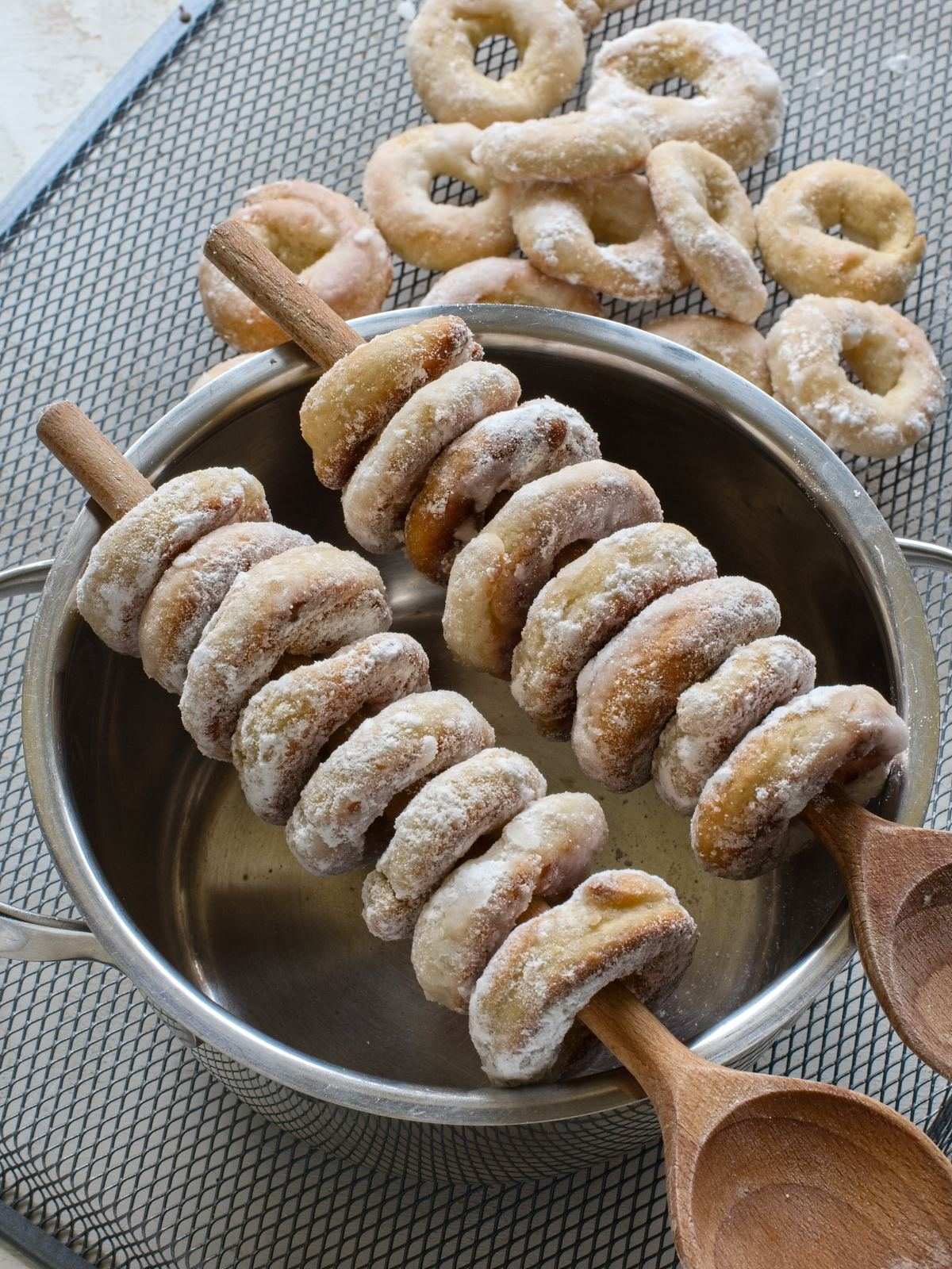 Czech Lomnické kroužky or Lomnice rings threaded on a wooden spoon.