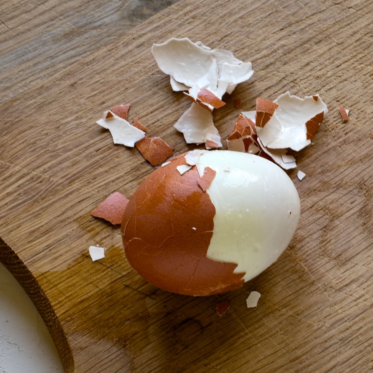 Half peeled hard-boiled egg.