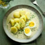 Czech chive sauce - pažitková omáčka, served with boiled potatoes and halved egg.
