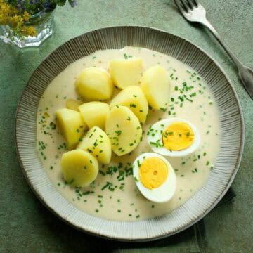 Czech chive sauce - pažitková omáčka, served with boiled potatoes and halved egg.