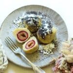 Czech potato dumplings with plums, topped with sweetened poppy seeds and drizzled with melted butter.