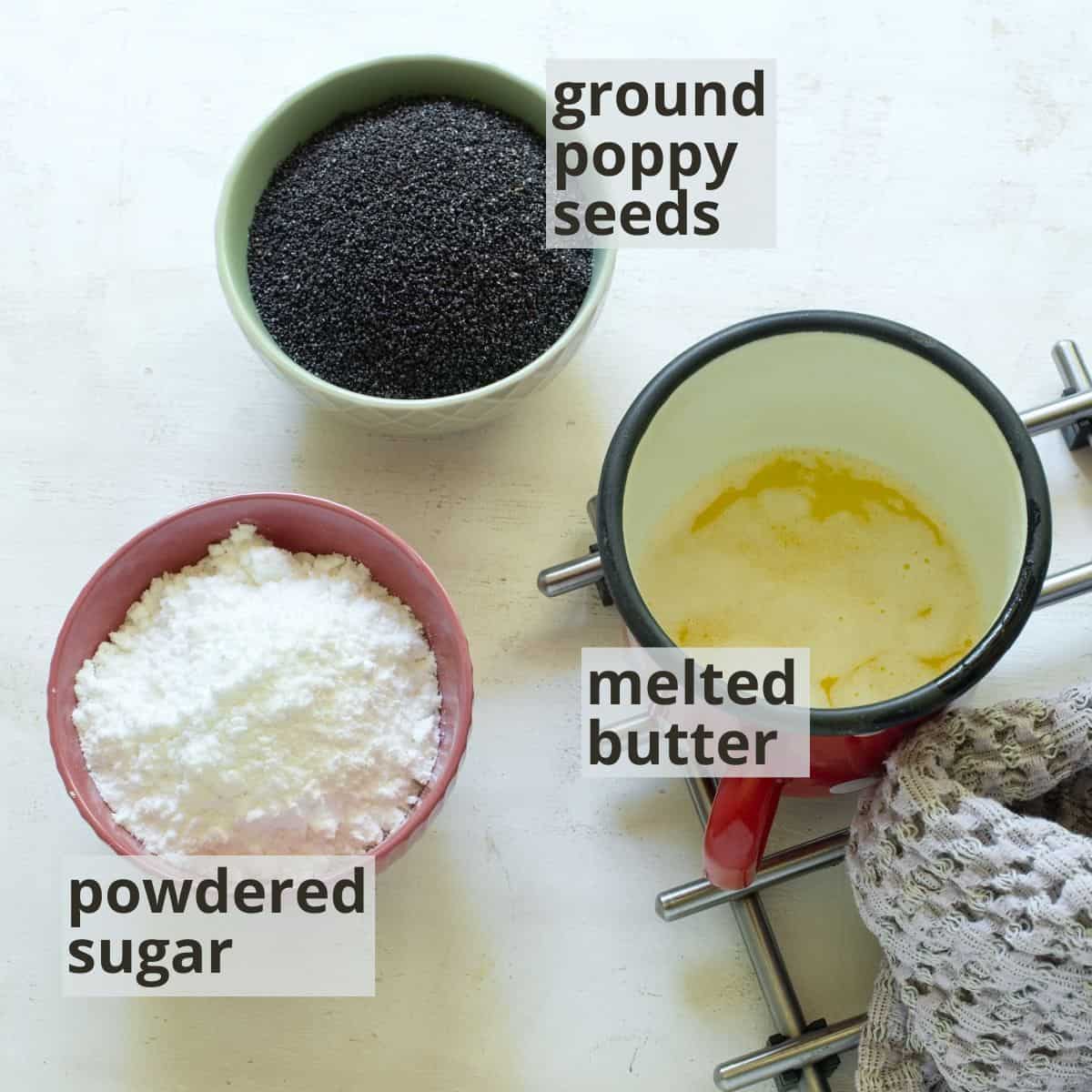 Labeled ingredients for plum potato dumplings: ground poppy seeds. sugar, butter.